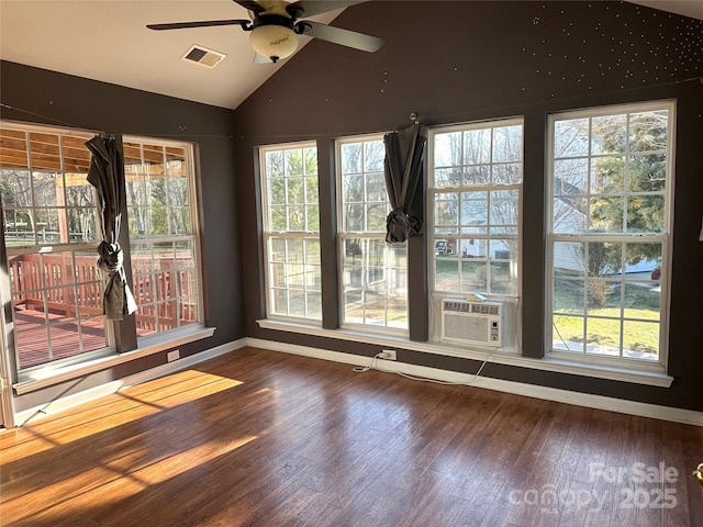 unfurnished room with hardwood / wood-style flooring, ceiling fan, lofted ceiling, and cooling unit