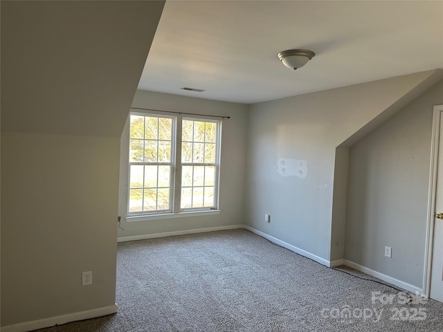 unfurnished room with carpet flooring