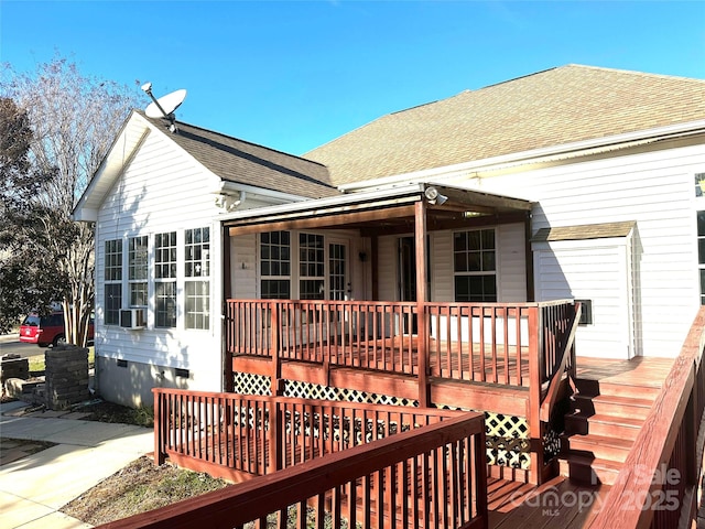 wooden terrace featuring cooling unit