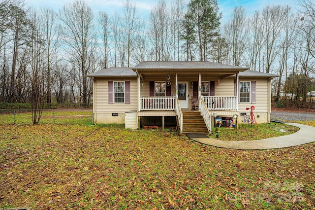 view of front of house with a front yard and a porch