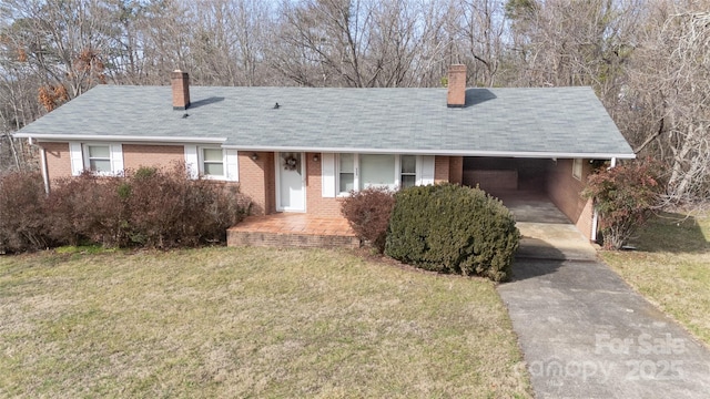 ranch-style home featuring brick siding, driveway, a carport, and a chimney