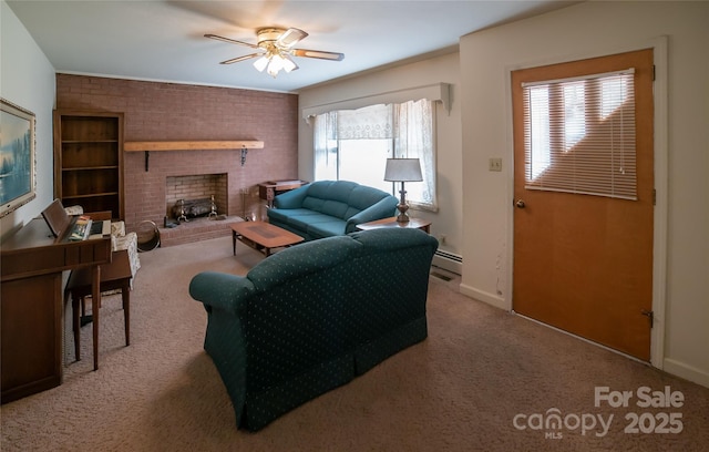 living area featuring a ceiling fan, carpet floors, brick wall, a fireplace, and baseboard heating