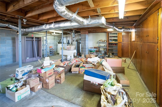 unfinished basement featuring washing machine and dryer