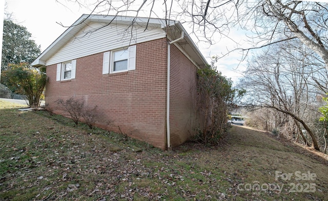 view of home's exterior with brick siding