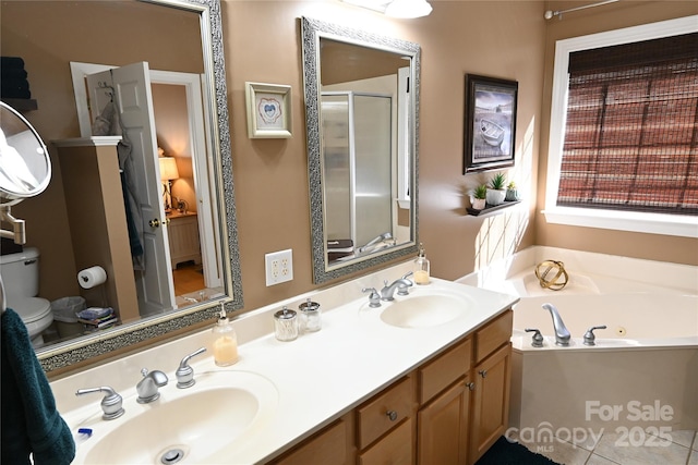 full bathroom with independent shower and bath, vanity, and toilet