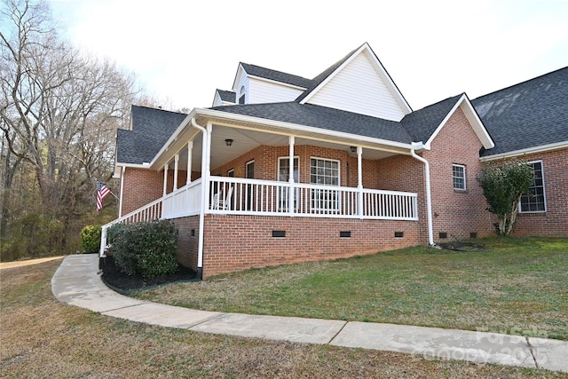 view of front of house featuring a front yard and covered porch