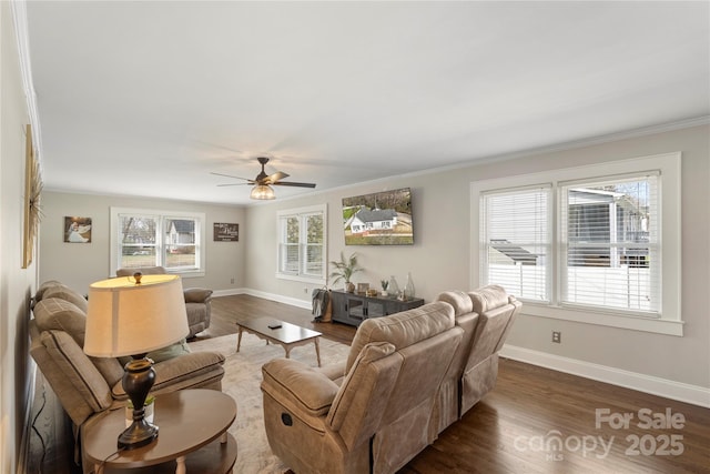 living area with crown molding, a ceiling fan, dark wood-type flooring, and baseboards