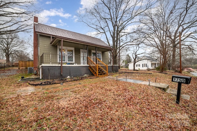 view of front of property with central AC and a porch