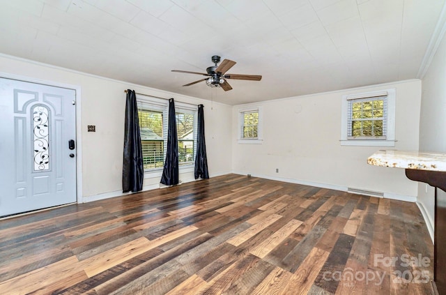 entryway with ceiling fan, wood finished floors, a healthy amount of sunlight, and crown molding