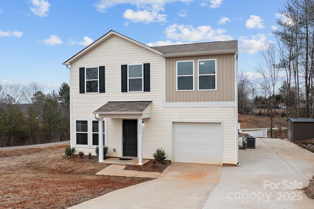 traditional-style house with driveway, central air condition unit, an attached garage, and board and batten siding