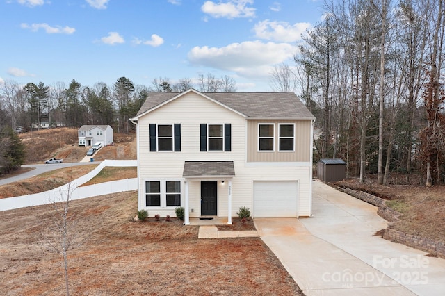 traditional-style home featuring a garage, driveway, and a shingled roof