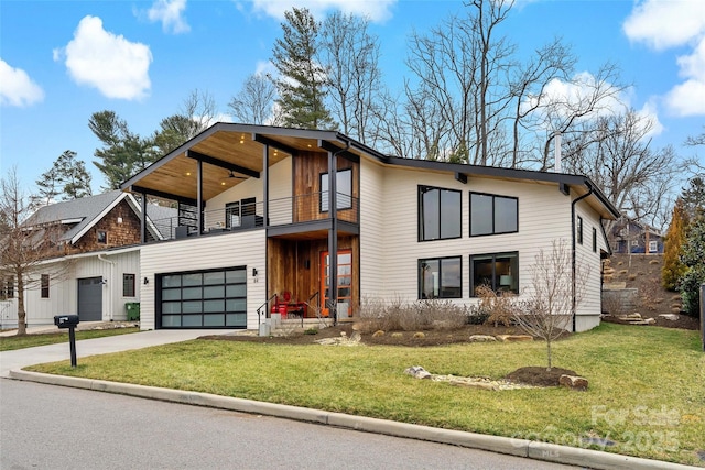 contemporary house featuring concrete driveway, a balcony, and a front lawn