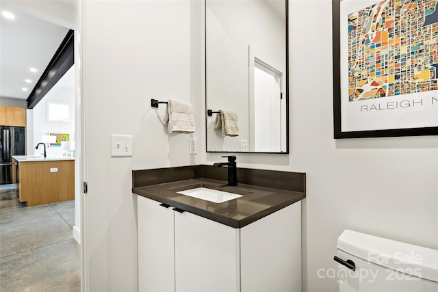 half bathroom with toilet, recessed lighting, finished concrete floors, and vanity