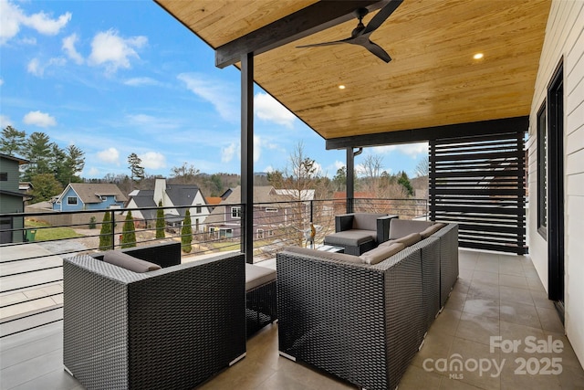 exterior space featuring ceiling fan, a residential view, and outdoor lounge area