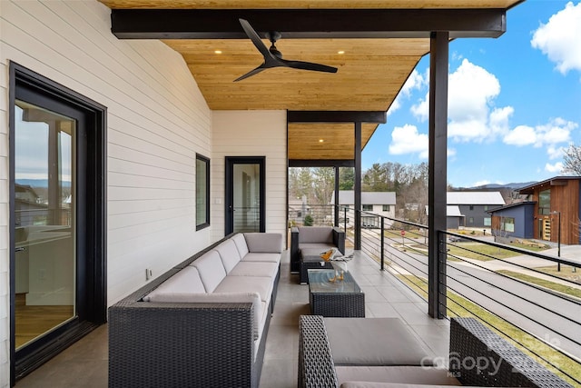 balcony with ceiling fan and an outdoor hangout area