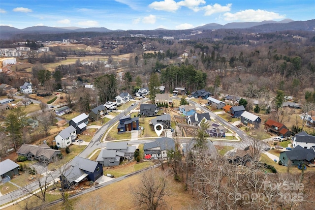 drone / aerial view with a residential view and a mountain view