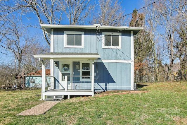 view of front facade with a front lawn and a porch