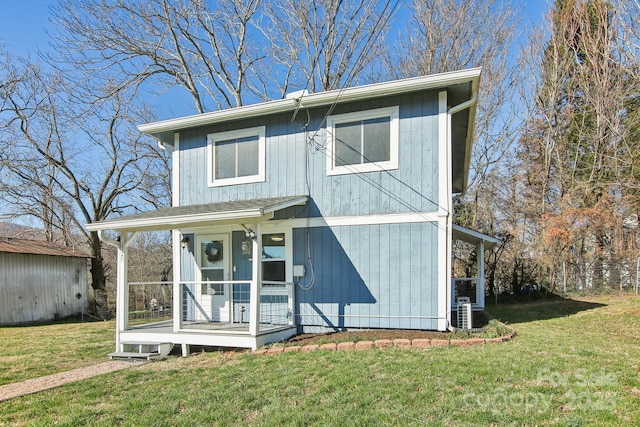 view of front facade with covered porch and a front lawn