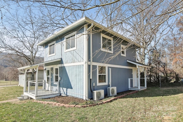 view of property exterior featuring ac unit and a lawn