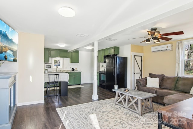 living room with dark wood-style floors, visible vents, a wall mounted AC, and a ceiling fan