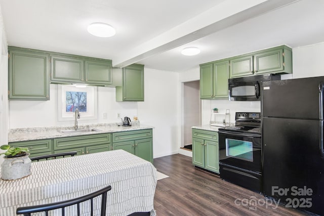 kitchen featuring green cabinets, dark wood finished floors, beamed ceiling, black appliances, and a sink