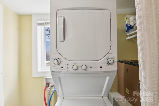 washroom with laundry area and stacked washer and clothes dryer