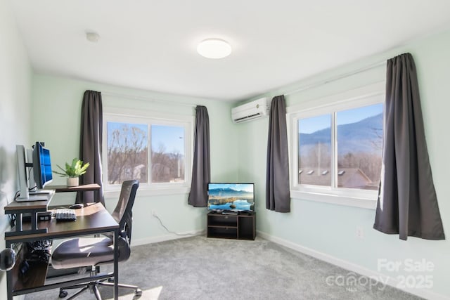 home office featuring a wall mounted air conditioner, baseboards, a wealth of natural light, and carpet floors