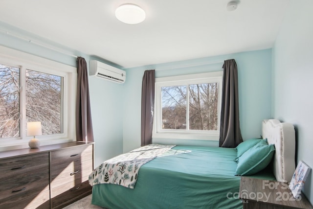 bedroom with multiple windows and an AC wall unit