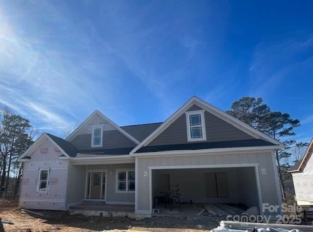 view of front of property featuring a porch and a garage