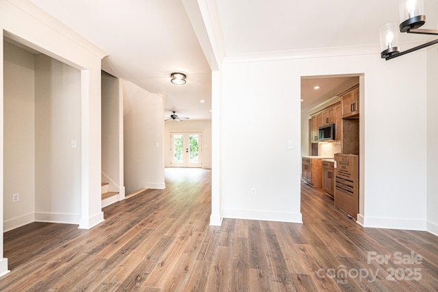 0 6th St NW, Hickory, NC 28601 - empty room featuring wood finished floors, baseboards, stairs, ceiling fan, and ornamental molding