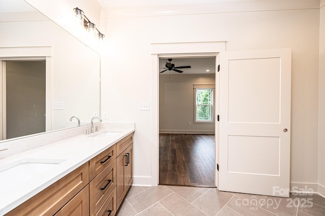 0 6th St NW, Hickory, NC 28601 - bathroom with double vanity, baseboards, a ceiling fan, and tile patterned floors