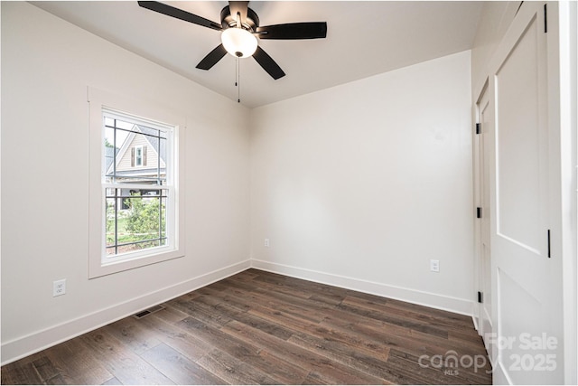 0 6th St NW, Hickory, NC 28601 - unfurnished room with dark wood finished floors, baseboards, and a ceiling fan