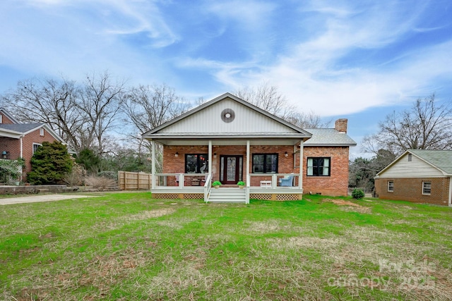 view of front of house with a front lawn and a porch