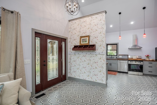 foyer with a chandelier and sink