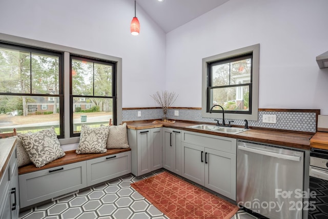 kitchen with gray cabinets, dishwasher, sink, and hanging light fixtures