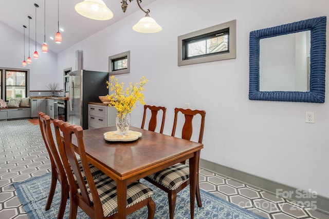 dining area featuring lofted ceiling