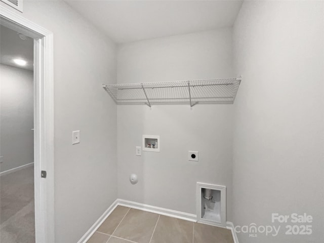 laundry area with hookup for a washing machine, hookup for a gas dryer, hookup for an electric dryer, laundry area, and baseboards