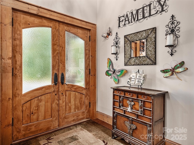 entrance foyer featuring wood-type flooring and french doors