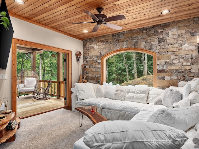 living room featuring wooden ceiling and a healthy amount of sunlight