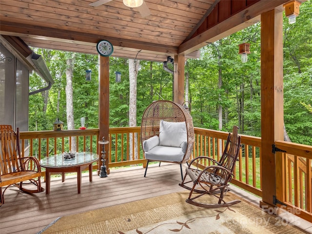 wooden terrace featuring ceiling fan