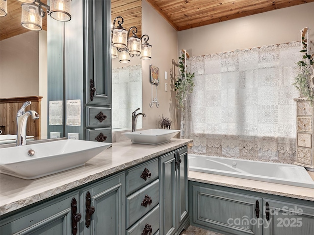 bathroom with vanity, wooden ceiling, and a bathtub