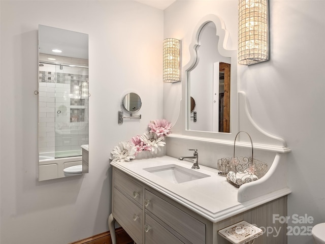 bathroom with vanity and bath / shower combo with glass door