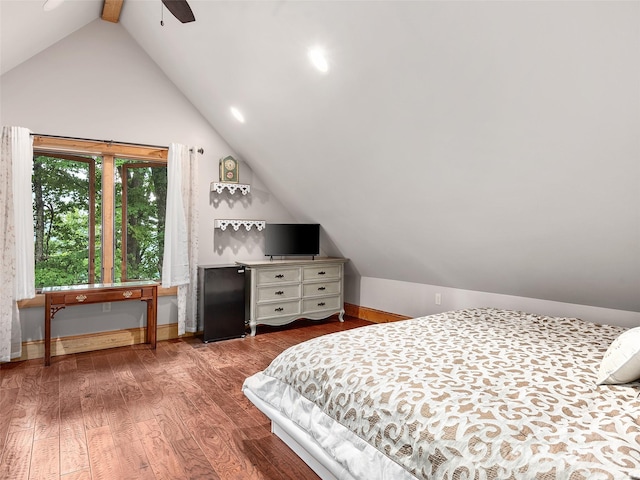 bedroom featuring ceiling fan, lofted ceiling, and wood-type flooring