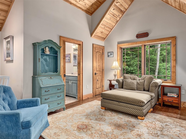 sitting room with high vaulted ceiling, light hardwood / wood-style flooring, and wooden ceiling