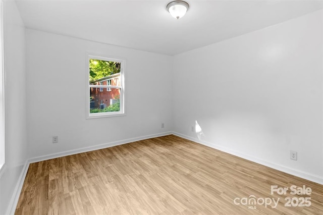 spare room featuring light wood-type flooring