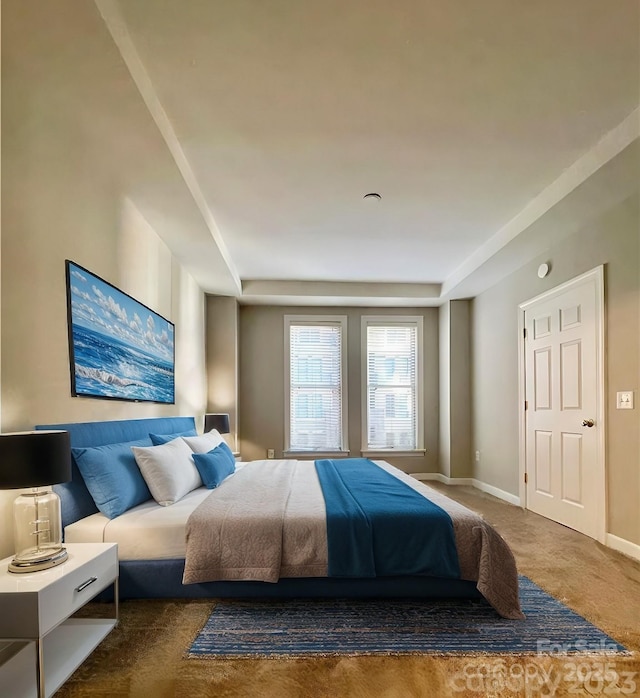 bedroom featuring carpet floors and baseboards