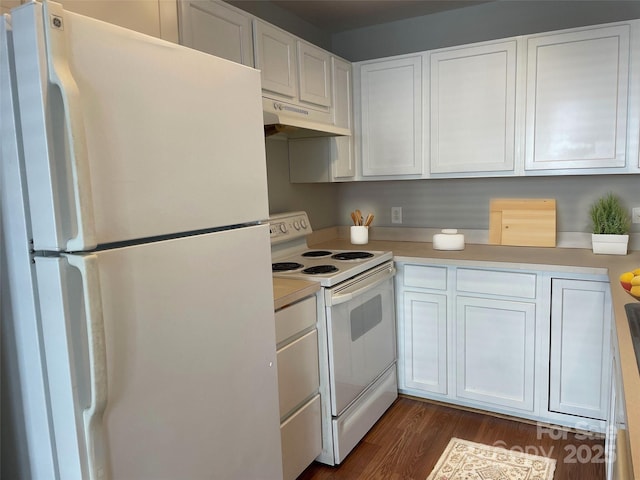 kitchen featuring white appliances, light countertops, under cabinet range hood, and white cabinets