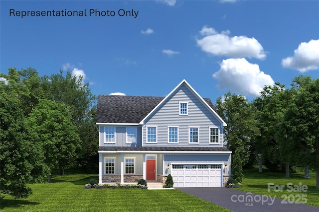 view of front of house with a garage and a front yard