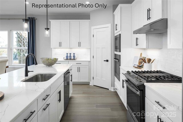 1809 Ab Moore Jr Dr Unit 3238, Indian Trail, NC 28079 - kitchen with gas range, under cabinet range hood, wall oven, a sink, and recessed lighting