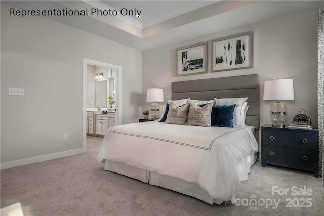1809 Ab Moore Jr Dr Unit 3238, Indian Trail, NC 28079 - bedroom with light colored carpet, baseboards, connected bathroom, and a tray ceiling
